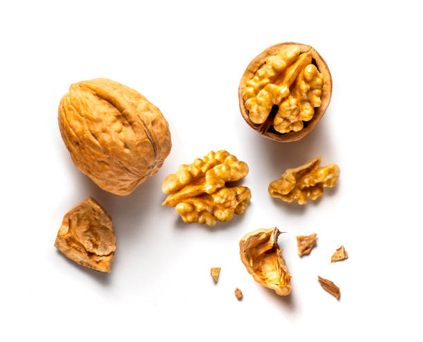 istock one whole and one open walnut isolated on white background 2063250506