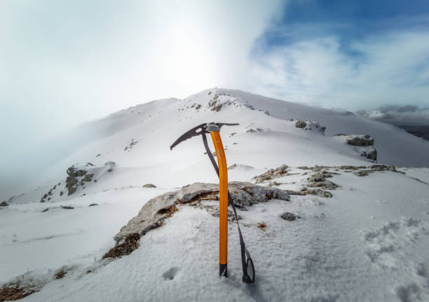 Mount Cantari, Italy - 3 March 2024 - In the Monti Simbruini mountain range with Monte Viglio, one of hightest peaks in Lazio region, here in winter with snow and summit cross.