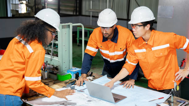 istock Multiracial engineer team collaborates in a factory brainstorm, uniting diverse skills for innovative solutions. 2063257360