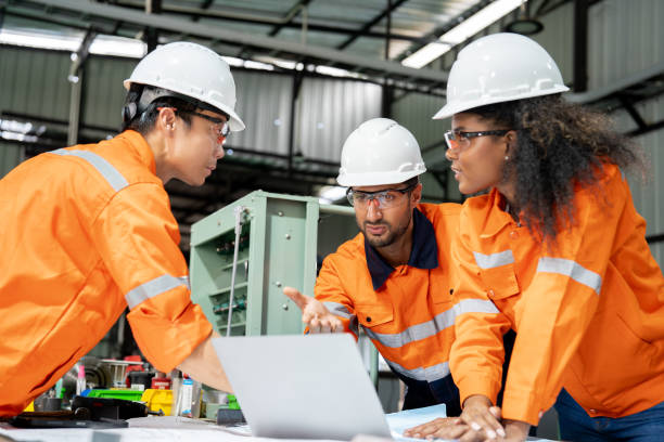 istock Multiracial engineer team collaborates in a factory brainstorm, uniting diverse skills for innovative solutions. 2063258421
