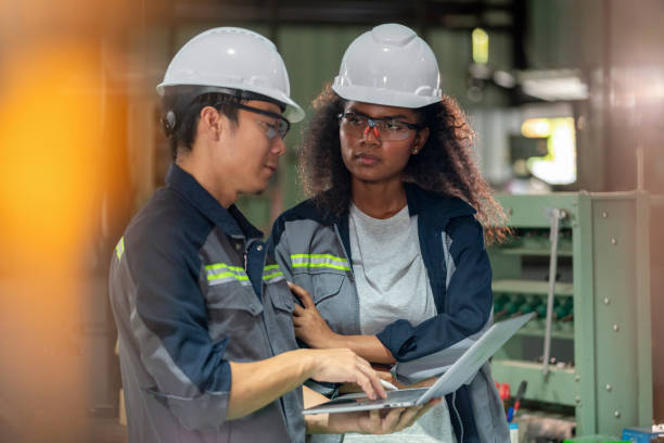 istock Ensure Quality in Industrial Workpieces. Expert technician and engineer collaborate to inspect the quality of industrial workpieces, ensuring they meet the highest specifications. Underscore the attention to detail and commitment to excellence. 2063261057