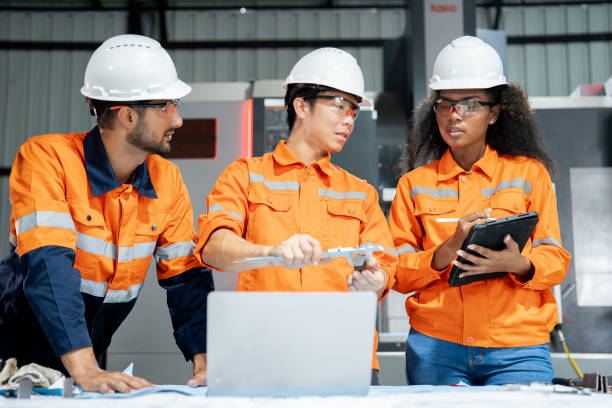istock Multiracial engineer team collaborates in a factory brainstorm, uniting diverse skills for innovative solutions. 2063266330