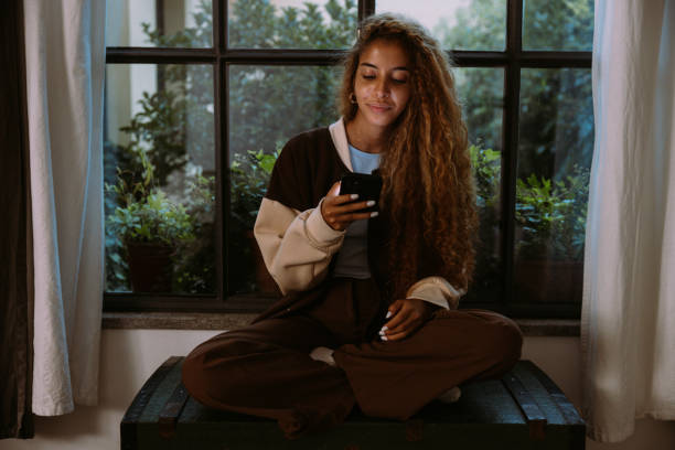 istock Teenager checking savings account on mobile app 2063290628