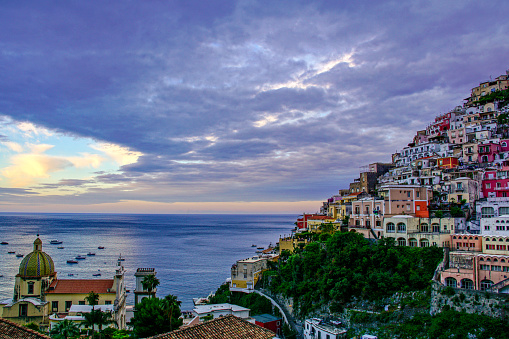 Vibrant Sunrise over the breathtaking beauty of Positano along the Amalfi Coast of southern Italy in Europe.