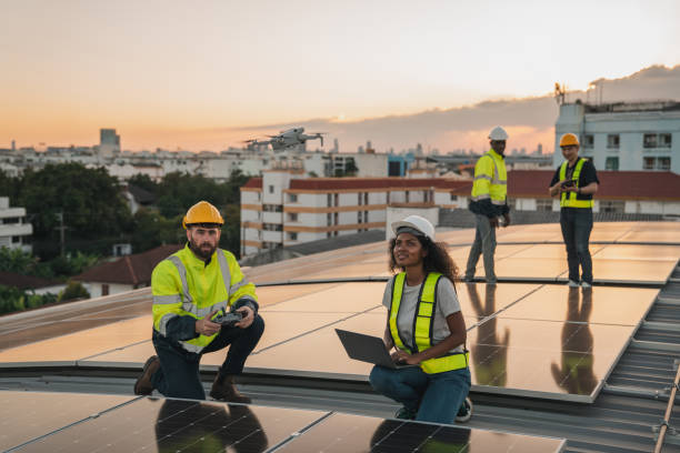 istock Service engineer checking solar cell on the roof for maintenance with drone technology. Engineer worker install solar panel. Clean energy concept. 2063291756