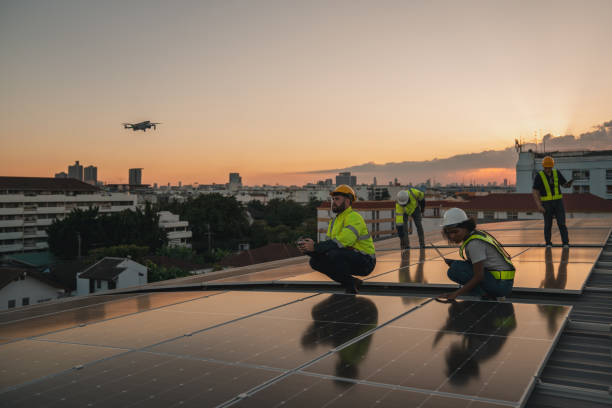 istock Service engineer checking solar cell on the roof for maintenance if there is a damaged part. Engineer worker install solar panel. Clean energy concept. 2063294401