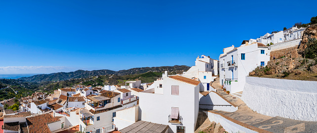 View towards the traditional whitewashed houses of the historic centre of Frigiliana, one of the most beautiful towns in the Costa del Sol (5 shots stitched)