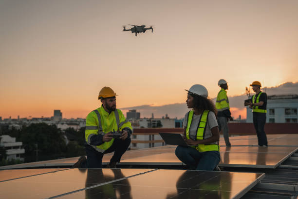 istock Service engineer checking solar cell on the roof for maintenance with drone technology. Engineer worker install solar panel. Clean energy concept. 2063305199