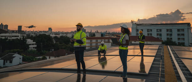 istock Service engineer checking solar cell on the roof for maintenance with drone technology. Engineer worker install solar panel. Clean energy concept. 2063306244