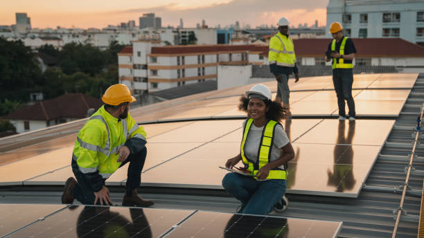 istock Service engineer checking solar cell on the roof for maintenance if there is a damaged part. Engineer worker install solar panel. Clean energy concept. 2063307302