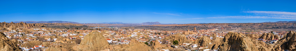 View on Guadix, with the characteristic residential district, the imposing cathedral' bell tower and the fortress of the Alcazaba, that began to be built around the 10th century (10 shots stitched)