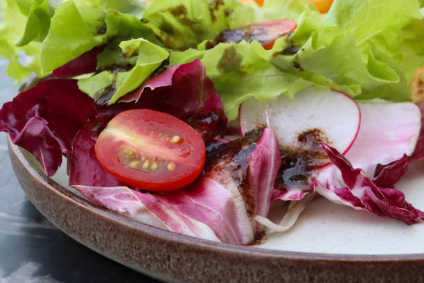 salad with tomatoes, arugula and sesame