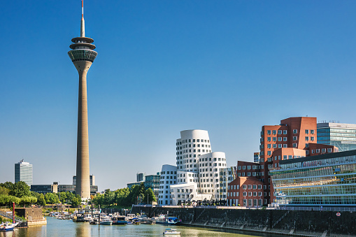Dusseldorf, Germany: View of Media Harbor, Medienhafen,  and Television Tower, Rheinturm,  with Blue Sky
