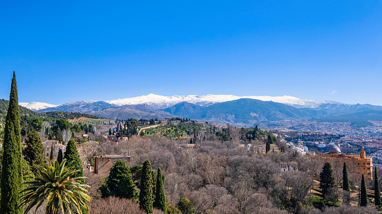 The snow-capped mountains of the Sierra Nevada seen from Granada, one of the beautiful cities in Andalusia