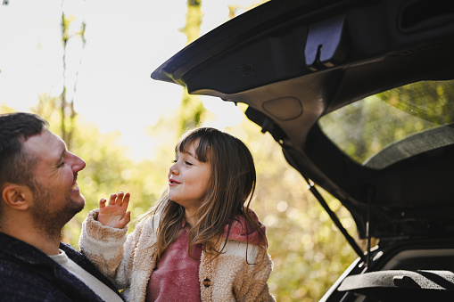 Family having fun outdoors in road trip.