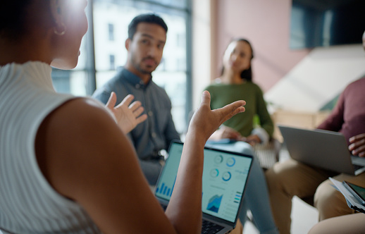 Meeting, laptop and business people with charts, graphs and data analysis at startup seminar. Feedback, workshop and stats on screen with team building, conference and performance planning in office