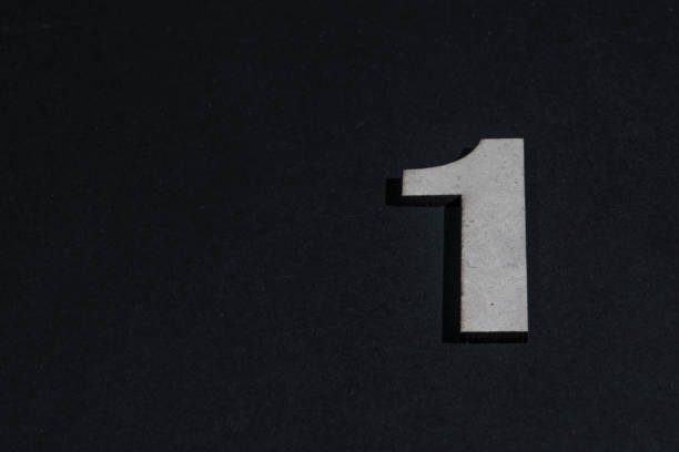 istock Number one in wood on pink background 2063370268