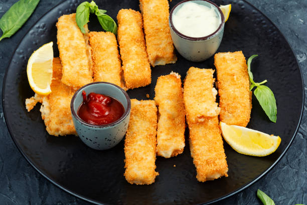 istock Breaded fish fingers with lemon, fish sticks. 2063389812