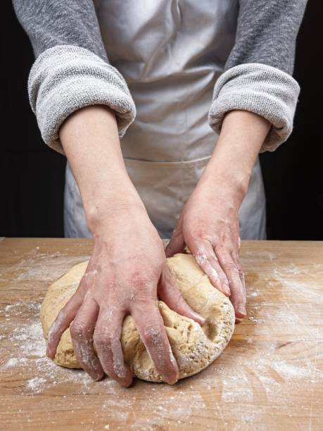 istock Grabbing the dough for the next knead. 2063400559