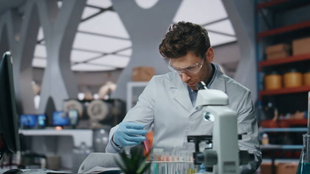 istock Laboratory scientist researching disease in clinic close up. Man holding samples 2063402564
