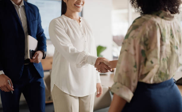 istock Business people, handshake and agreement or smile for contract, support and collaboration. Partnership, hiring and welcome for acquisition of company, networking and thank you in meeting of closeup 2063428594
