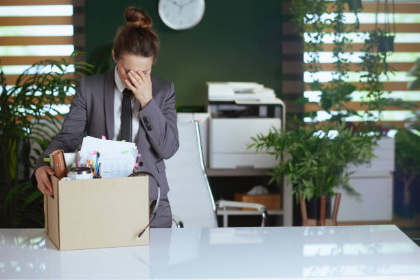 istock sad modern woman worker in modern green office 2063451381