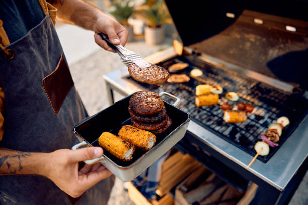 istock Close up of man preparing barbecue, 2063453039