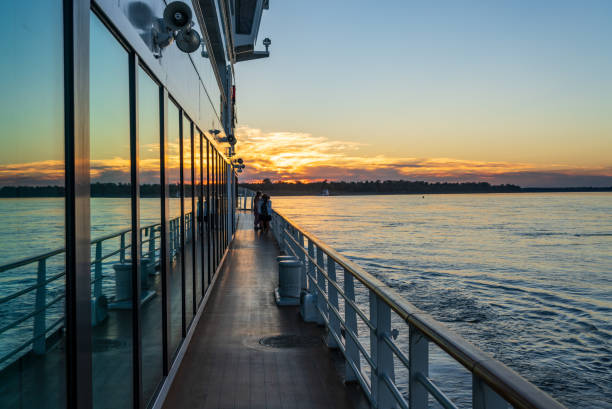istock Dramatic sunset reflected in windows of Mississippi river cruise boat 2063454201