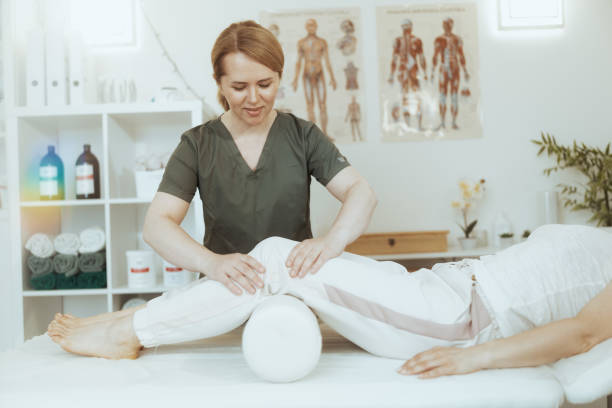 istock smiling therapist woman in massage cabinet doing checkup 2063454753