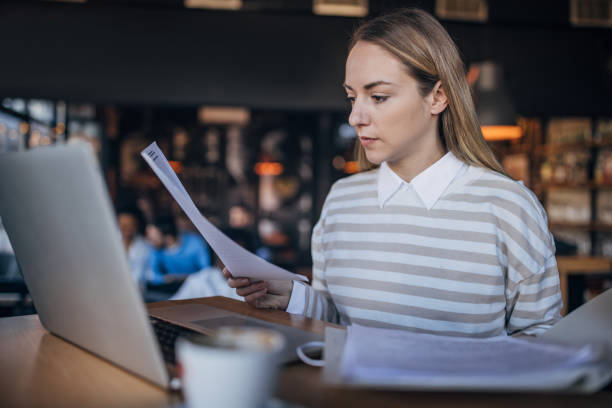 istock Businesswoman using laptop in cafe 2063456859