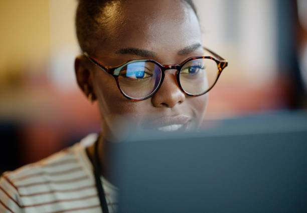 istock Face, black woman and university student on computer with smile for research, study and information for assignment. Female person, education and campus with revision for exams, test and assessment. 2063461185
