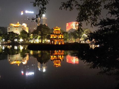 Turtle Tower by night, also called Tortoise Tower, a small tower in the middle of Hoan Kiem Lake (Sword Lake) in central Hanoi, Vietnam. It is one of the most iconic, symbolic and most recognizable pieces of architecture representing Hanoi.