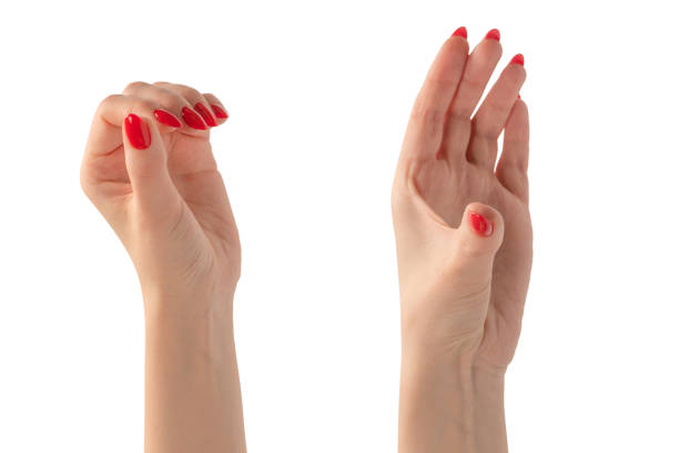 istock Woman hand with red nails holding something. 2063467176
