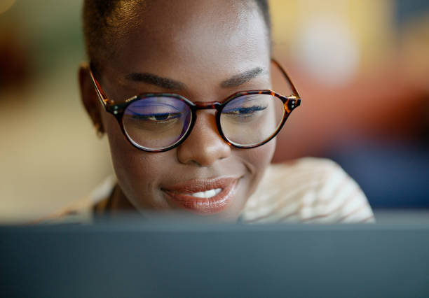 istock Face, black woman and college student on computer with smile for research, study and information for exams. Female person, education and university with revision for project, test and deadline. 2063480448