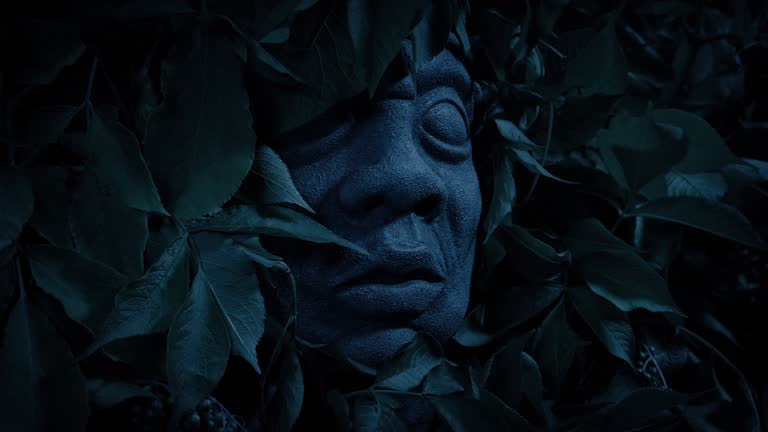 Ancient Statue Face In The Dark Jungle