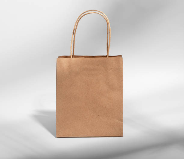 istock Kraft paper bag with handles, brown gift package, craft pack 2063511663