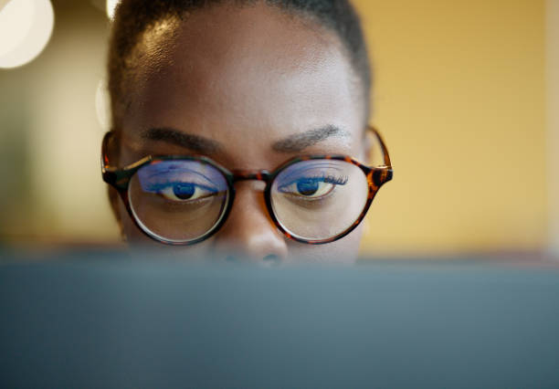 istock Face, black woman and university student on computer with glasses for research, study and information for project. Female person, education and college with revision for exams, test and deadline. 2063525930