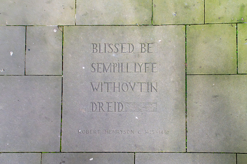 Inscription in a paving stone in Edinburgh.  A phrase from Robert Henryson 1425-1490.