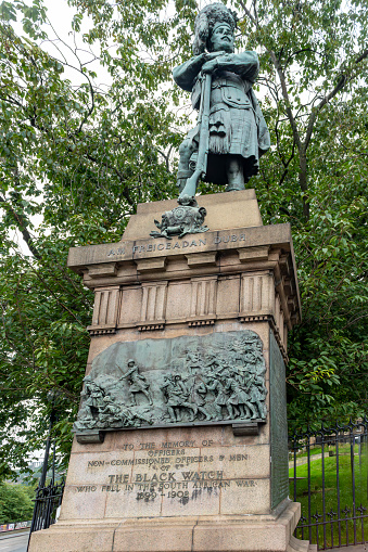 Black Watch War Memorial by William Birnie Rhind, RSA. Unveiled 1910. Bronze on a polished red granite base with the Black Watch crest above a bronze relief and bronze lettering. Junction of North Bank Street and Market Street, the Mound, Edinburgh.