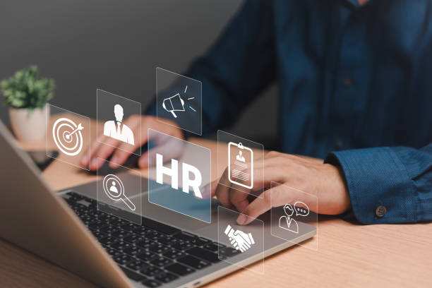 istock An HR manager engages with an interactive Human Resources management system on a laptop. 2063561411