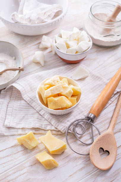 istock Organic cacao butter and baking ingredients with kitchen utensils 2063586536