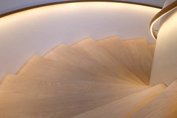 istock Stairs leading downward with lighted handrails 2063594614