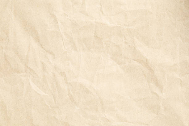 istock Brown crumpled paper texture with grains macro closeup 2063598855