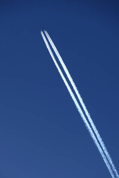 airplane trail in the clear blue sky, contrail