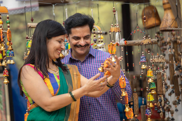 istock Happy couple buying souvenir at carnival 2063616849