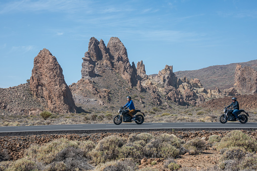 Tenerife, Canary islands - February 13, 2020: Couple of motorcyclists circulating through the Teide National Park