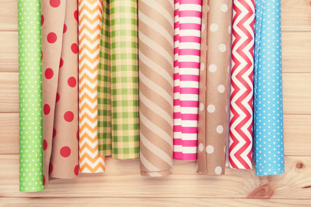 istock Rolls of craft papers on wooden background 2063667725