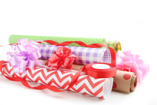 istock Rolls of craft papers with ribbon bows on white background 2063670315