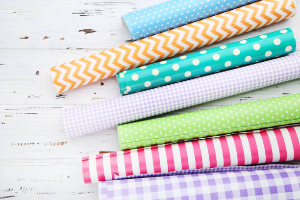 istock Rolls of craft papers on white wooden background 2063670849