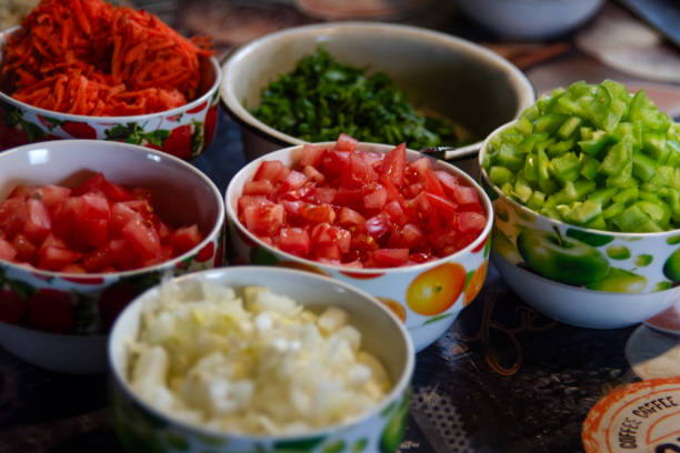istock Chopped vegetables - peppers, onions, carrots, tomatoes in separate plates 2063676701